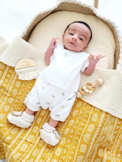 Baby Laying on Yellow Bamboo Cotton Blanket