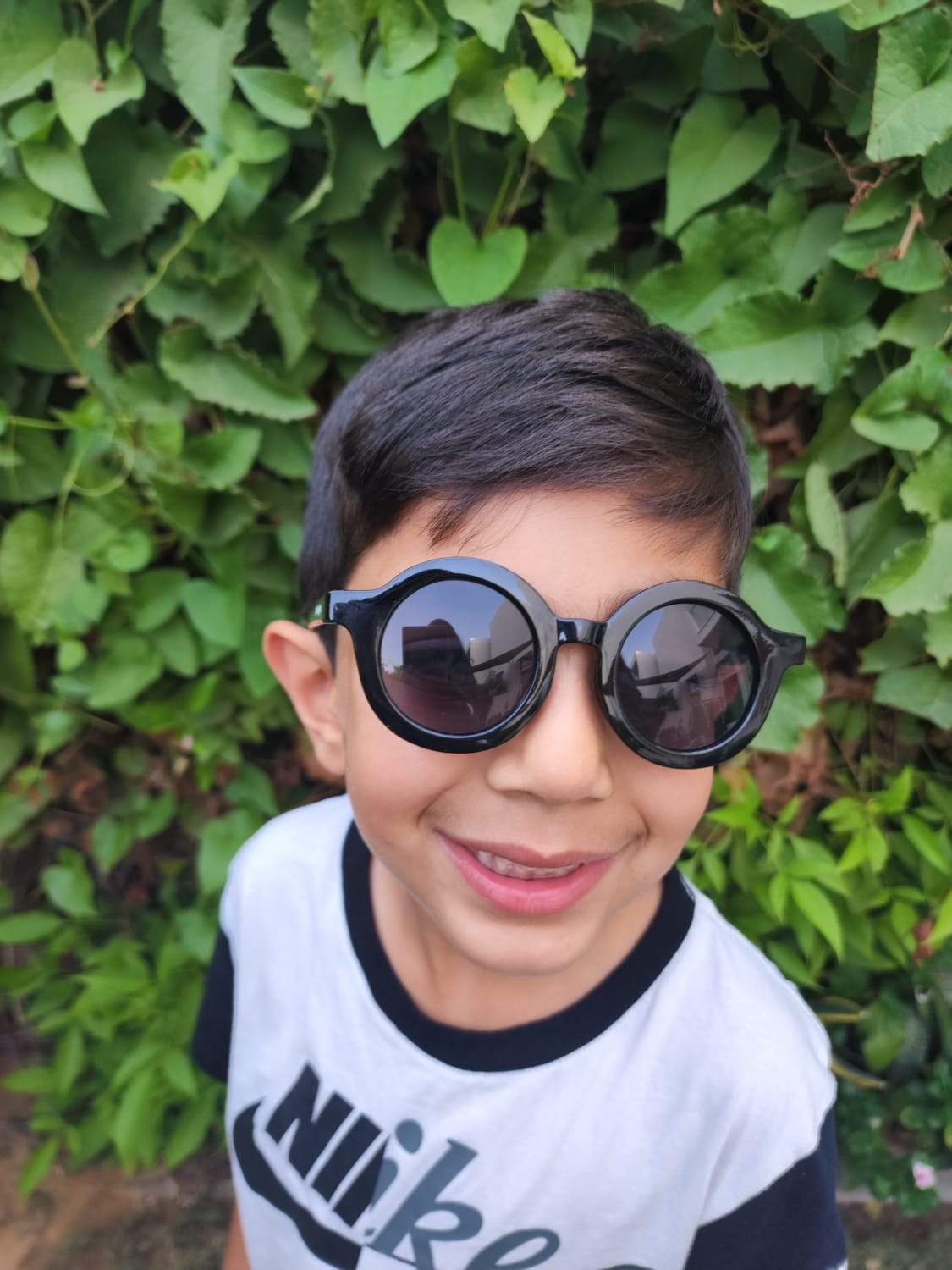 Kid Wearing Black Sunglasses | Little Giggles