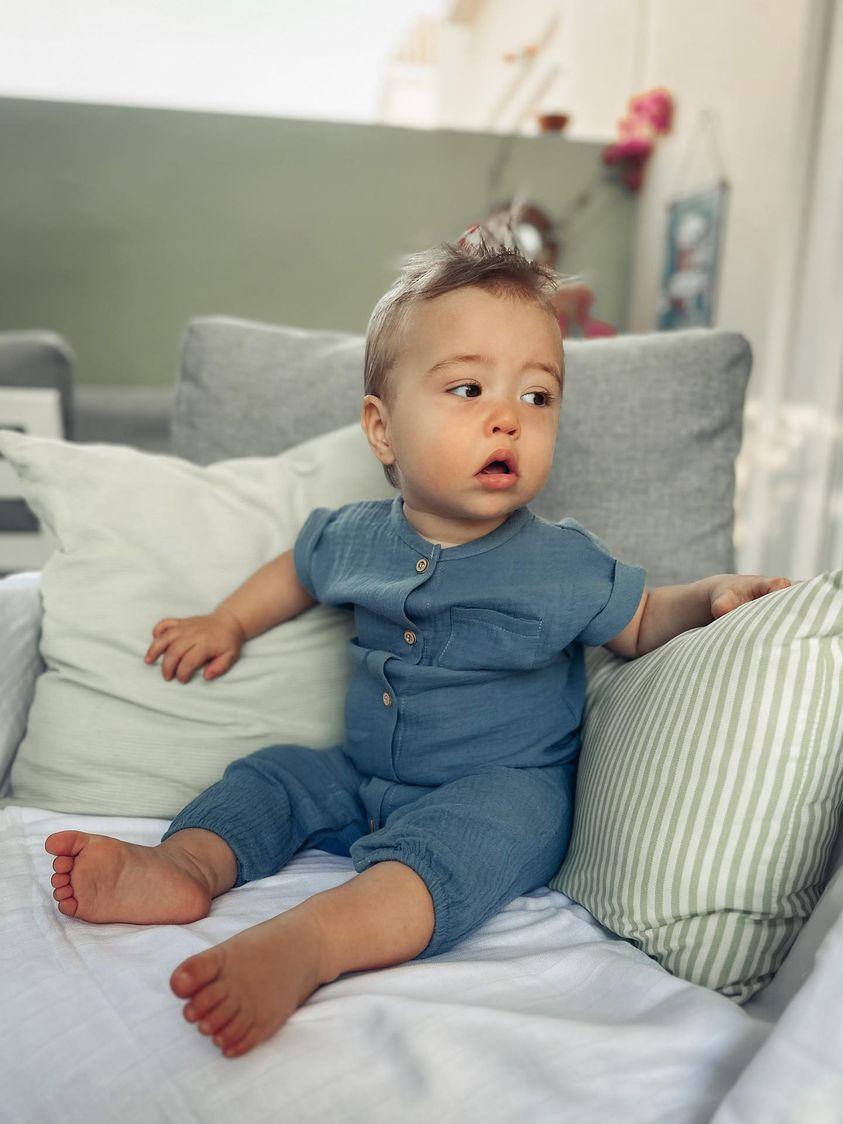Baby wearing Navy Austen Romper | Little Giggles
