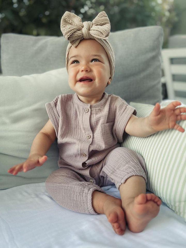 Baby Wearing Purple Austen Romper